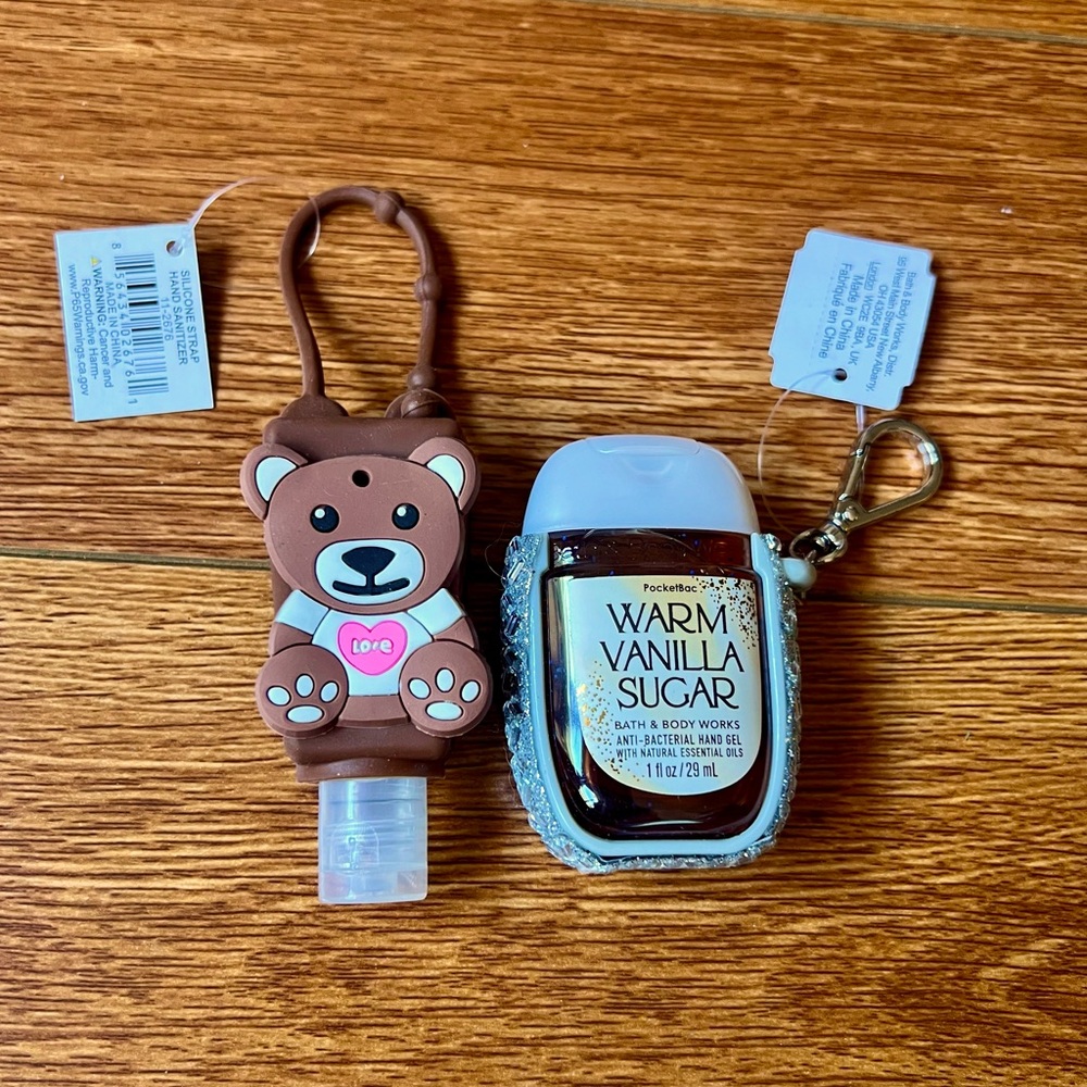 2 travel hand sanitizers with holders NWT